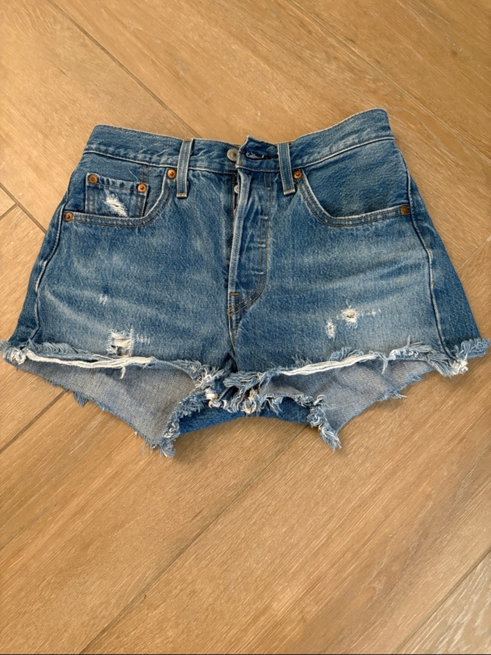 Levi's Medium Blue Distressed Cutoff Denim Shorts